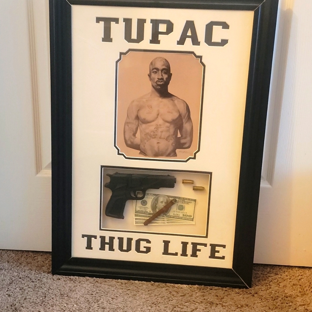Original tupac photo. With rubber material, 4- 100. Two real bullets.